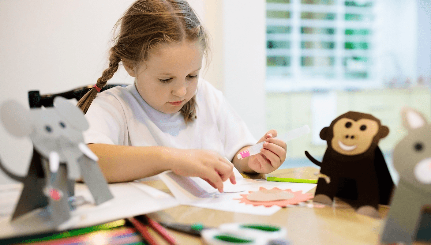 A young child working on a tablet in a wheelchair