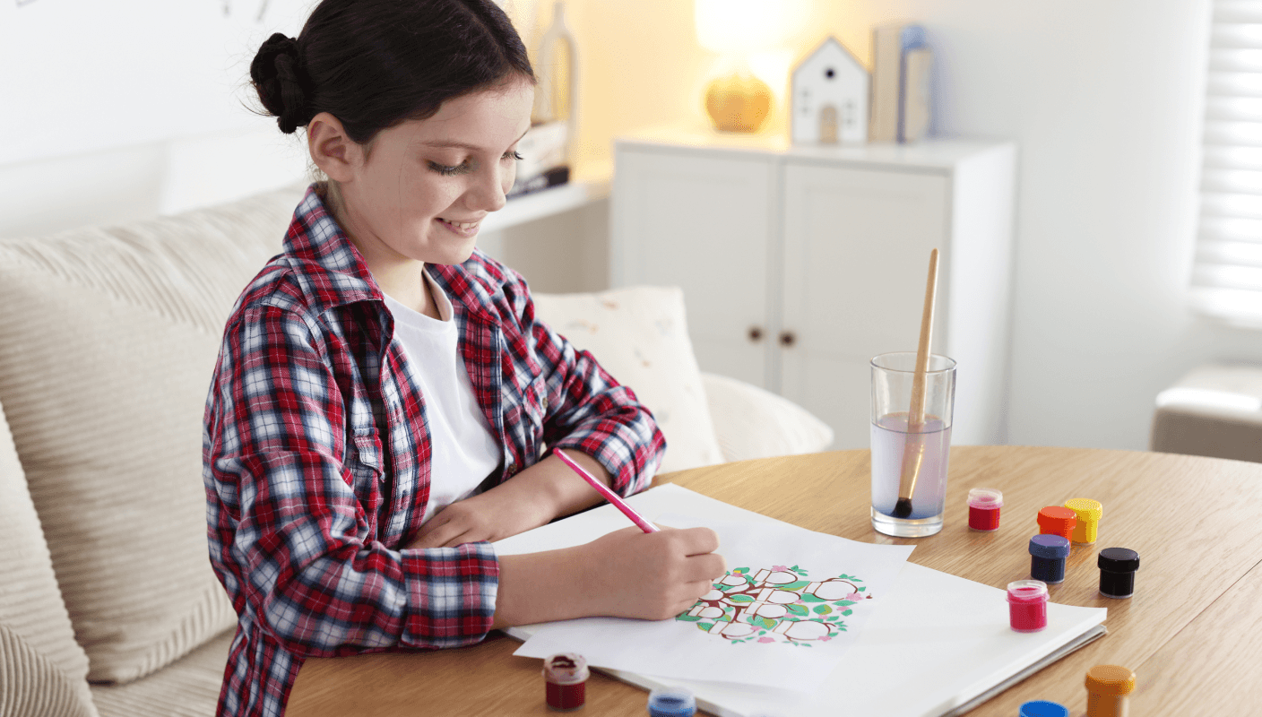 A woman studying with a child