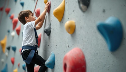 child on climbing wall