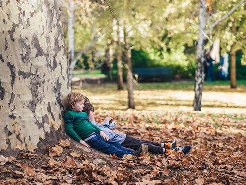 children resting at a park