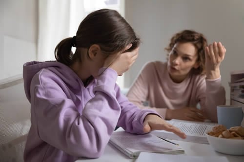 mother speaking to child about school