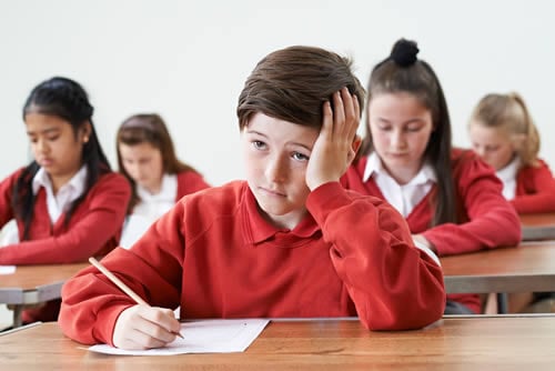 boy struggling in class