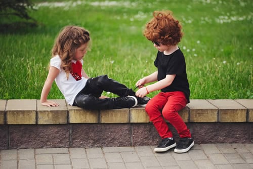 siblings helping each other