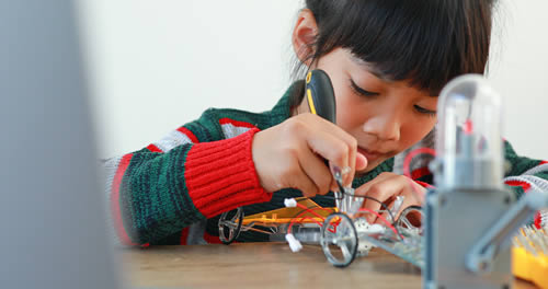 child working on engineering project