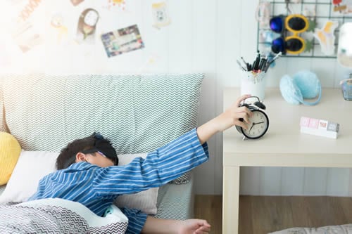 child waking up early for school