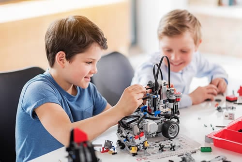 pda children playing with lego at school