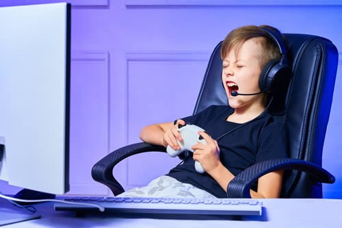 child talking to friends whilst playing video game