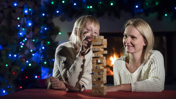 mother and child learning with Jenga