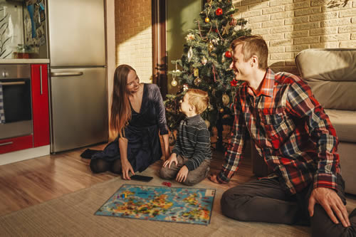 family playing board games at christmas