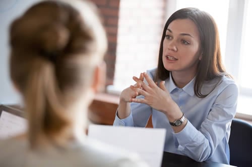 parent discussing concerns with teacher