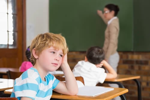 child blank expression in classroom