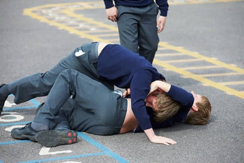 fighting children in playground