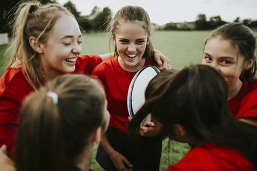 girl fitting in whilst playing sports at school