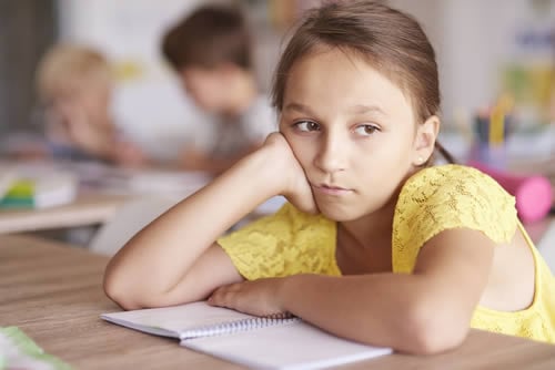 girl zoning out in classroom