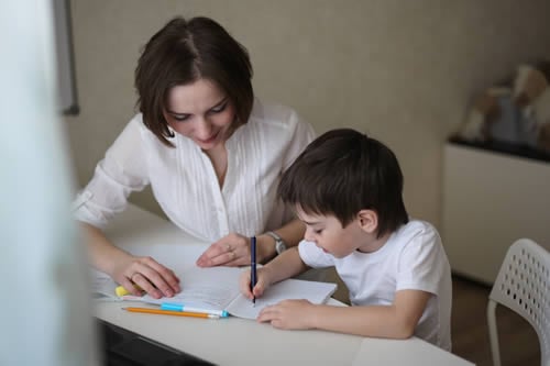 sen tutor enjoying teaching child