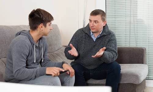 parent talking to teenage son