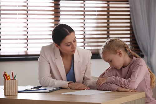 patient teacher with autistic child