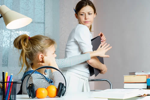 young girl refusing to do homework