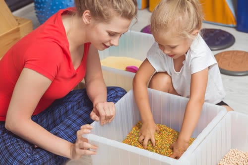 child engaging in sensory activities