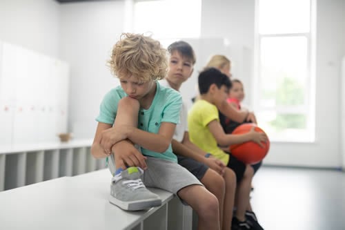 boy at school on his own