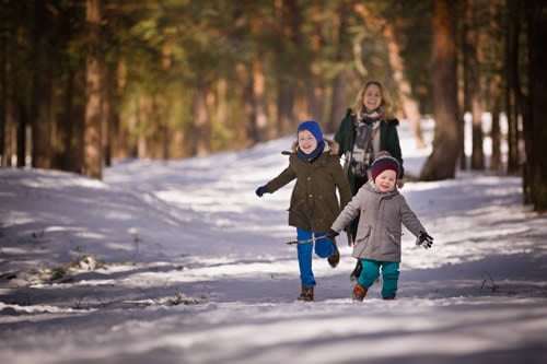 running in the snow in nature