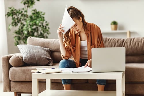 stressed mother with paperwork