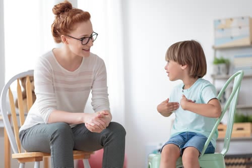 teacher listening to child