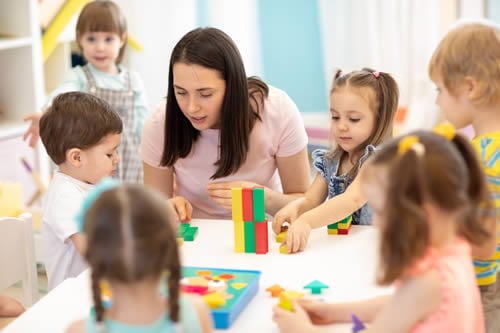 teacher with children taking turns patiently