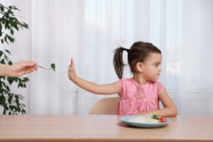 child refusing to eat food from fork