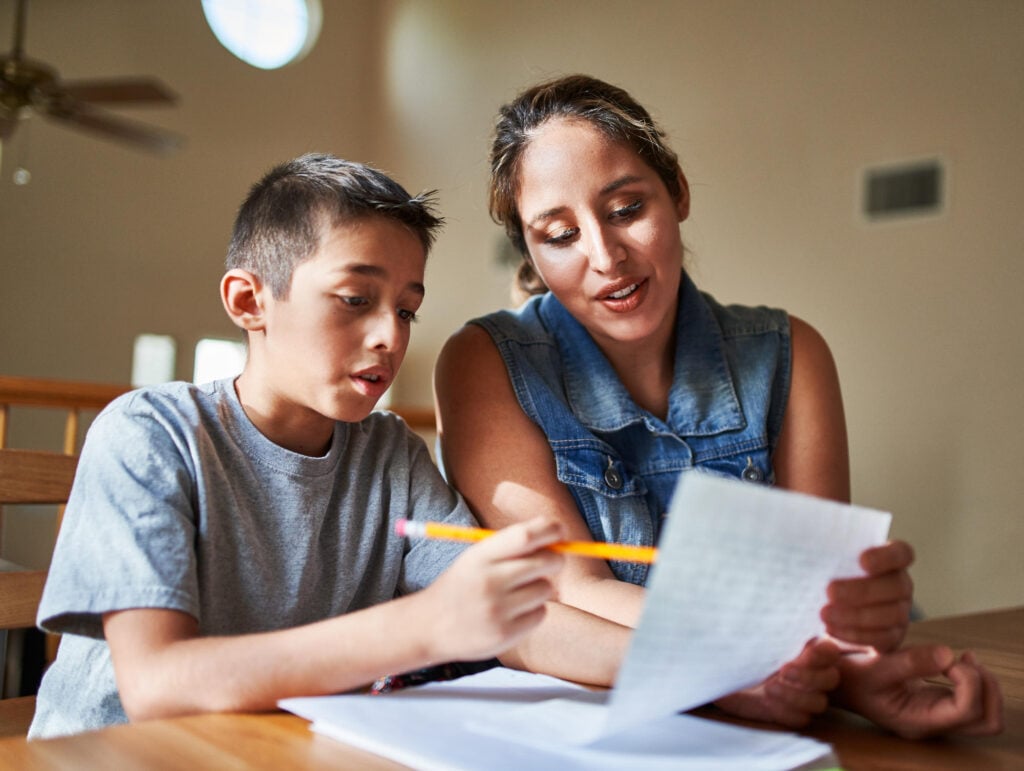 tutor helping boy during eotas tutor format
