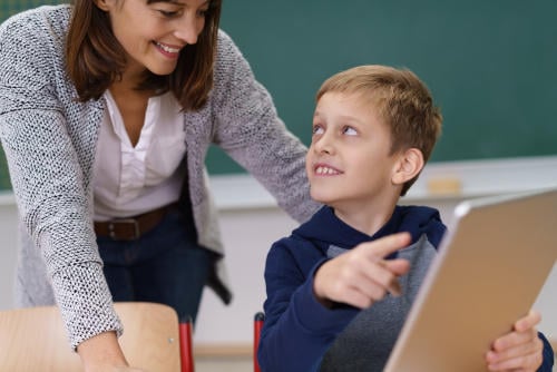 tutor with child using app