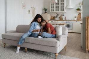 Loving caring woman calms anxious adhd teenage girl