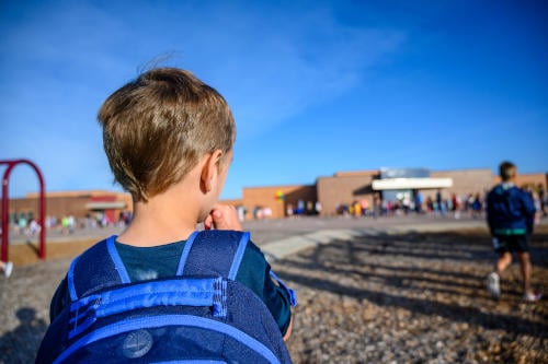 anxious adhd boy biting nails on first day of school
