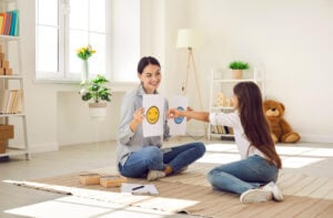 tutor using visual aids with autistic girl