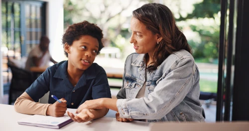 parent and child working together in homeschooling