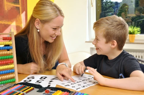 tutor helping dyslexic child