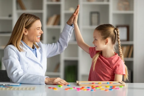 dyslexic child happy and feeling understood with tutor