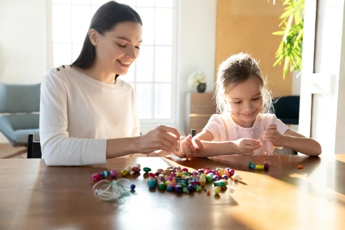 tutor with child at a table learning with visual cues