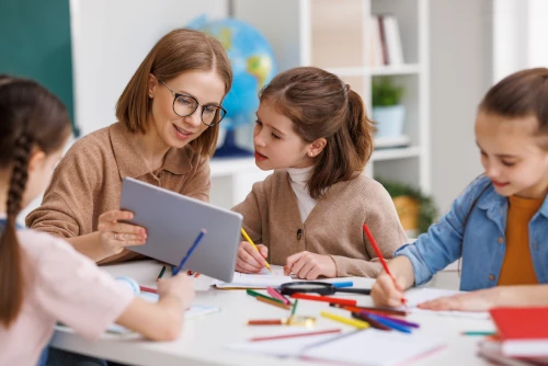 teacher helping anxious pupil